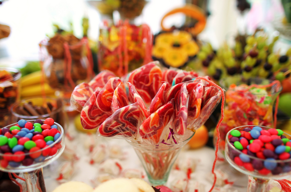 Candy buffet bar with bright colored candy