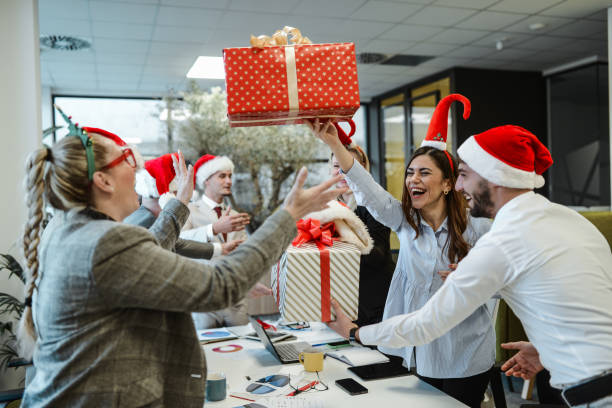 Office workers sharing gifts
